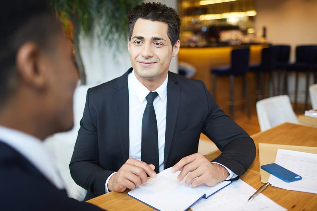 photo of lawyer in negotiation at table.